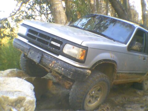 1991 Mazda Navajo - This silver SUV navigates a rocky trail, its Mazda grille clearly visible.