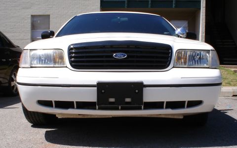 1998 Ford Crown Victoria - Front view of a white 1998 Ford Crown Victoria showing the grille and headlights.