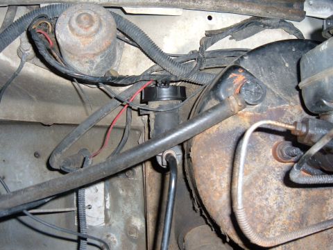 1985 Ford F-150 - Close-up view of the clutch master cylinder and brake booster assembly in a 1985 Ford F-150.