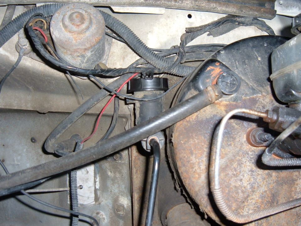 1985 Ford F-150 clutch master cylinder and brake booster assembly, showing rust and wiring