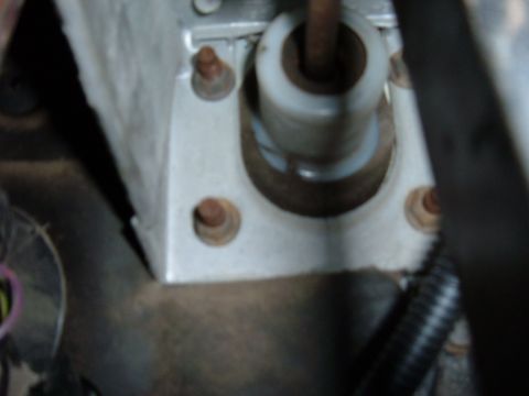 1985 Ford F-150 - Close-up view of the clutch master cylinder mounting bracket, showing bolts and internal components.