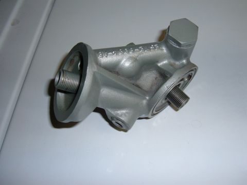 1985 Ford F-150 - This is an oil filter adapter with the part number E4TE-688-A1B clearly visible on its surface.