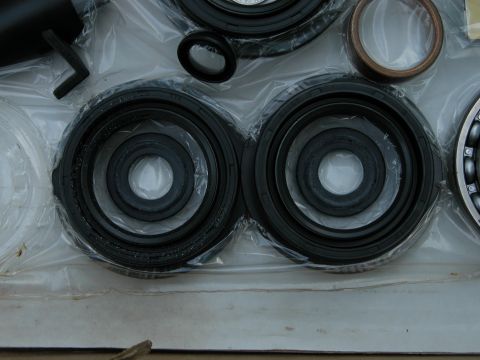 1990 Ford Bronco - Automotive seals and a bearing are packaged together for sale.