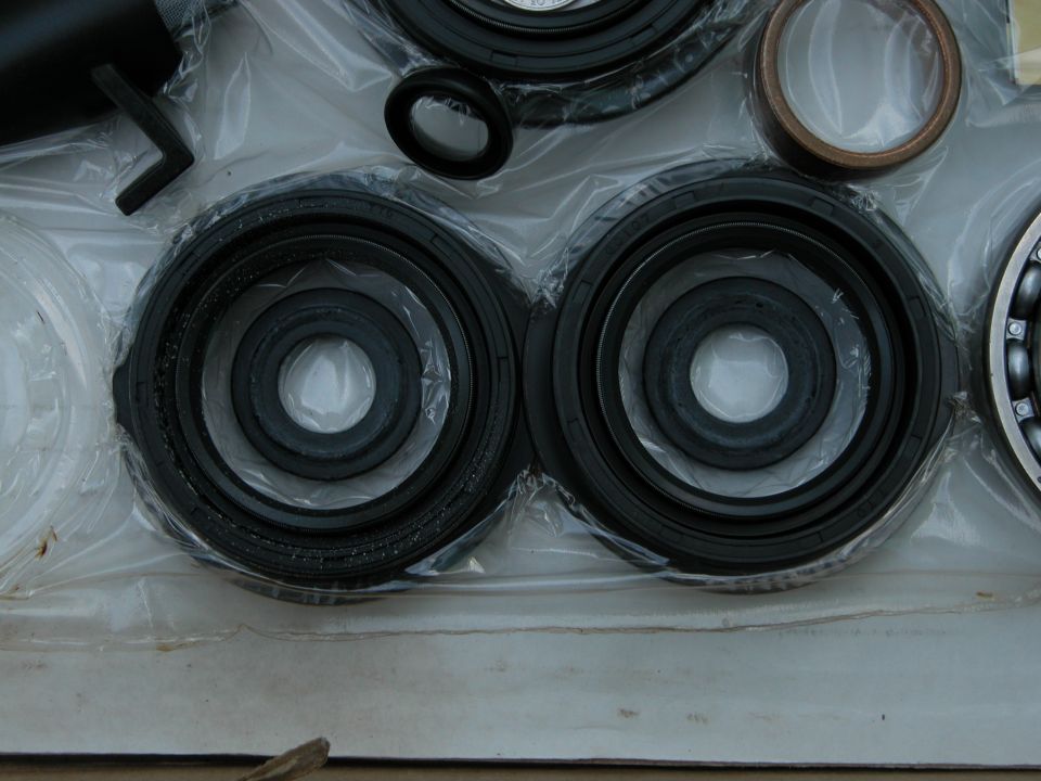 Transfer case rebuild kit in box: rubber seals, bronze bushing, ball bearing