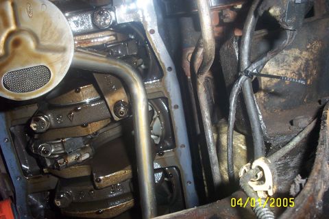 1979 Ford F-150 - Close-up of an engine's internal components, including the crankshaft and oil pan.