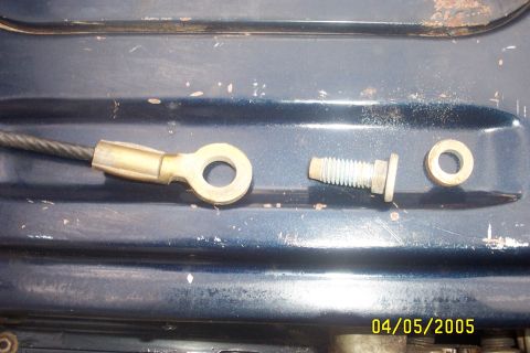 1979 Ford F-150 - A close-up view of a cable lug, a bolt, and a washer on a dark blue surface, with a date stamp of 04/05/2005.