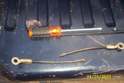 1979 Ford F-150 - A screwdriver and broken cables are visible on a dark blue surface, dated 04/05/2005.