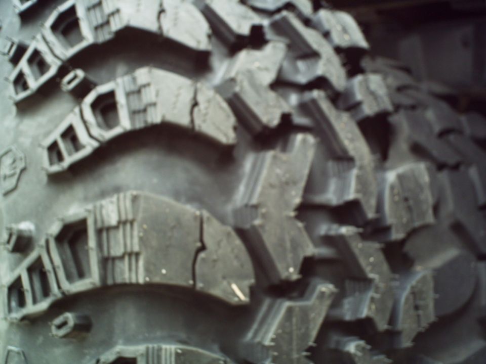 Close-up of aggressive off-road tire tread pattern