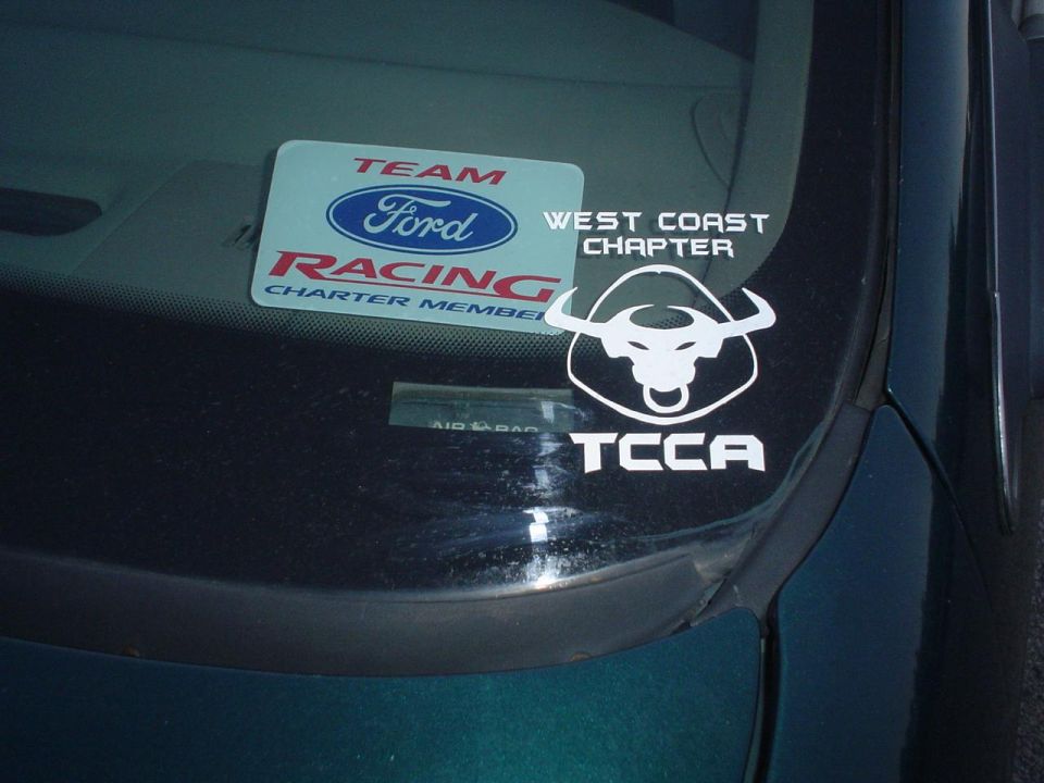 Green car windshield with Ford Racing and TCCA stickers