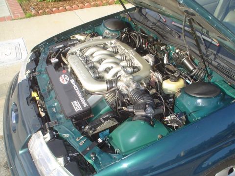 1993 Ford Taurus - Engine bay of a Ford SHO, showing the V6 engine and intake system.