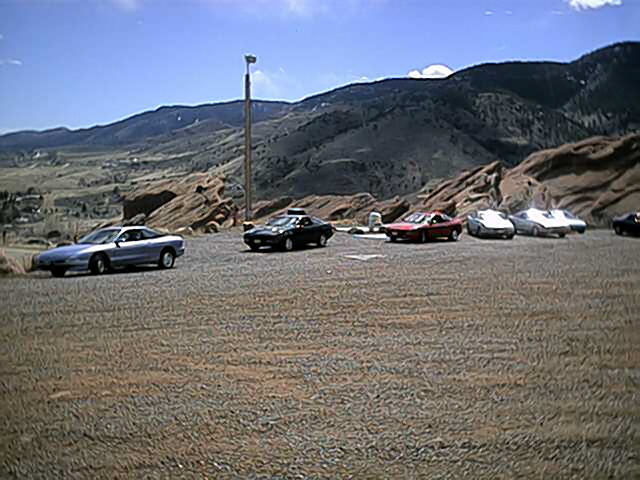 Silver 1996 Ford Probe with black spoiler parked outdoors