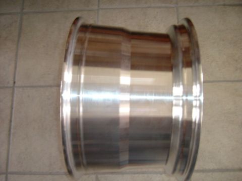 1993 Ford Bronco - An aluminum wheel is shown from the side, with a visible lip and polished surface.