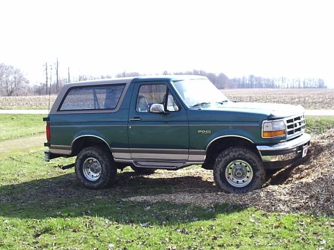 1996 Ford Bronco - This 1996 Ford Bronco is shown in a three-quarter front view, parked off-road.