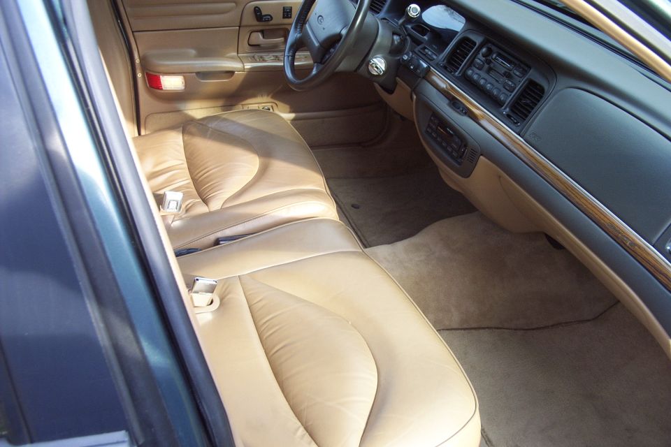 1996 Ford Crown Victoria interior showing tan leather seats and dashboard