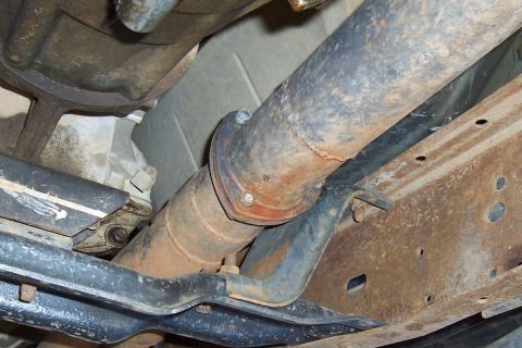 1994 Ford F-150 - Underside view of a vehicle's exhaust system and frame components.