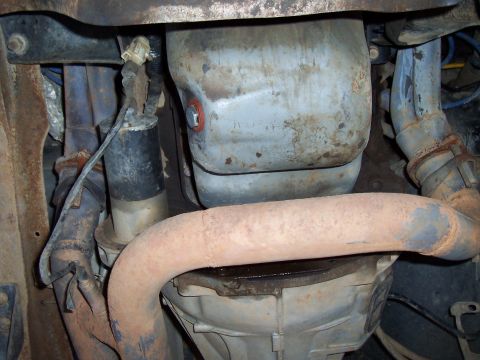 1994 Ford F-150 - Underside view of exhaust system parts and starter motor.
