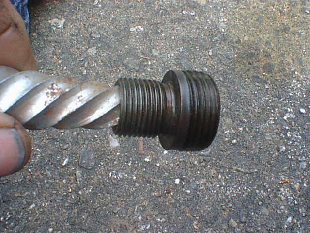 Here is the threaded fitting after removal. I used a large EZ out but you can also use Vice Grips. If you use Vice Grips be sure to stick a bolt in the center hole so when you clamp on the fitting won't colapse.