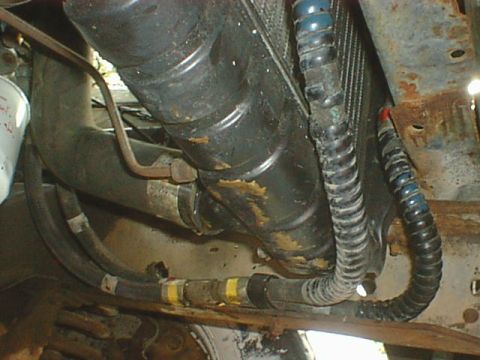 1976 Ford F-250 - Here is where the lines are routed. Very clean and easy. Nothing in the way but I did fold a small tab on the bottom of the radiator side s…