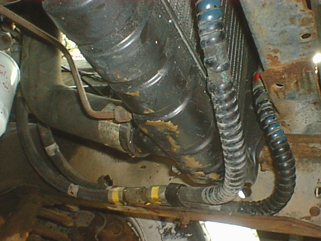 Here is where the lines are routed. Very clean and easy. Nothing in the way but I did fold a small tab on the bottom of the radiator side support bracket flat to give just a little more clearance. It did not actually hit but it was a sharp edge and closer than I liked. I just grabbed it with pliers and bent it flat.