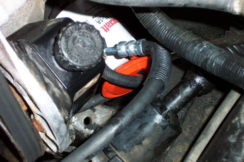 1992 Ford Bronco - Saginaw pump installed; the orange thing is the power steering filter. This is with one of the earlier hoses that did not work.