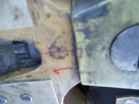 1988 Ford Bronco - A close-up view shows a vehicle component with red markings, possibly for alignment or measurement.