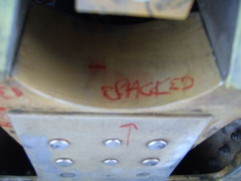 1988 Ford Bronco - A close-up view of a vehicle component shows red marker text indicating a crack.