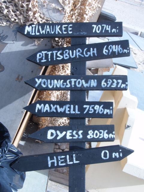 1988 Ford Bronco - Signpost lists distances to various locations, including 'Hell' at 0 miles.