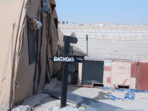 1988 Ford Bronco - A signpost indicates Baghdad is 700 miles away from this desert military installation.