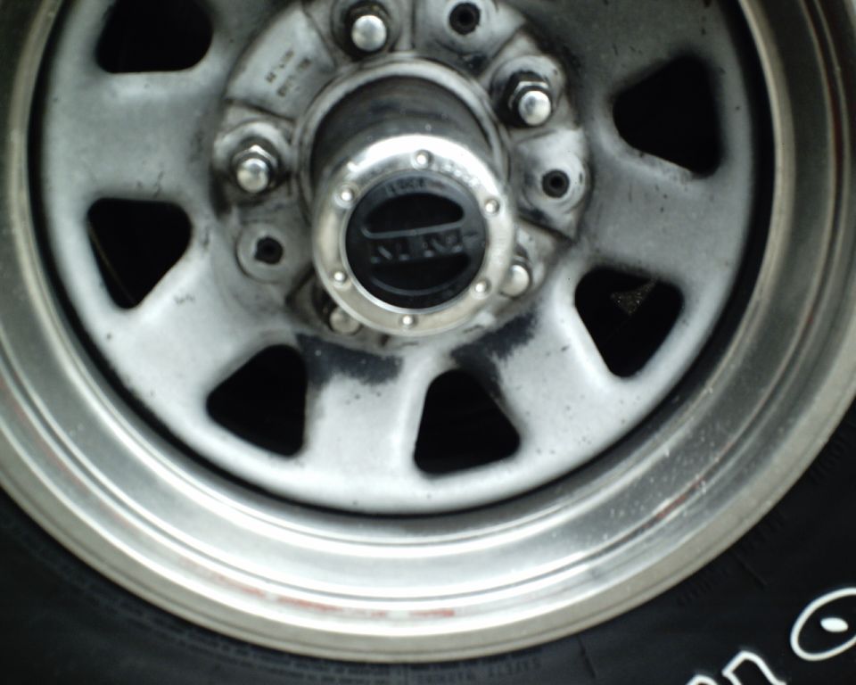 Close-up of a wheel hub with a black center cap