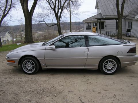 1990 Ford Probe - Silver 1990 Ford Probe coupe parked outdoors on a gravel surface.