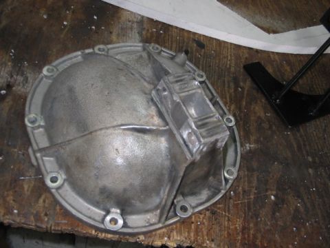 1985 Ford LTD Crown Victoria - A differential cover is shown on a workbench.