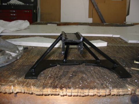1985 Ford LTD Crown Victoria - Custom fabricated metal part shown on a workbench, likely for automotive use.