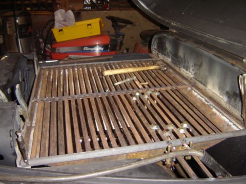 1992 Ford Bronco - Fabricated steel slatted rack/frame welded together, sitting in a garage with toolboxes and a table saw in the background.