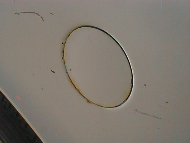 This is the plug a truck has in the bed if it did not come with a rear tank. Ford had to do this because they used the same bed sides on all trucks so they were pre-punched for a rear filler.