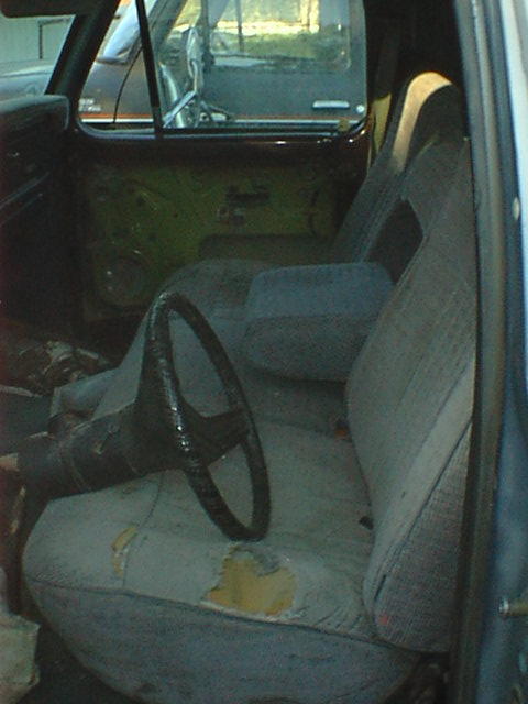 1976 Ford F-250 - Not a pretty seat but a good start. I found two identical 89 F150 front seats with arm rests for $5.00 each! since they match the upholster…
