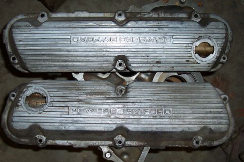 1994 Ford F-150 - Two Ford valve covers are shown, each with "POWERED BY FORD" stamped into the metal.