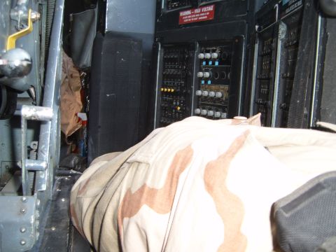 1988 Ford Bronco - Control panels and camouflage fabric are visible inside a vehicle's interior.