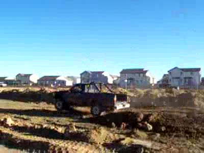 1987 Toyota T100 - Jumping a dirt jump... ouch