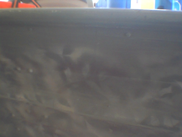 Gray painted metal surface with Supermotors.net watermark