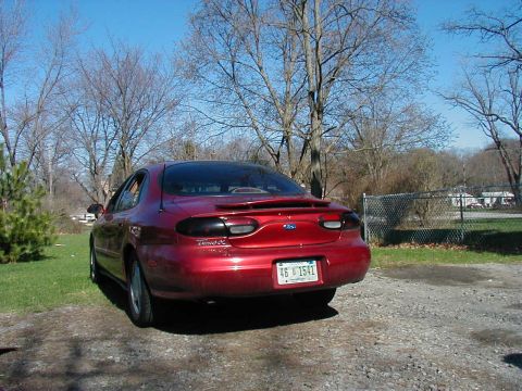 1997 Ford Taurus - This 1997 Ford Taurus is shown from the rear, a spoiler and a license plate.