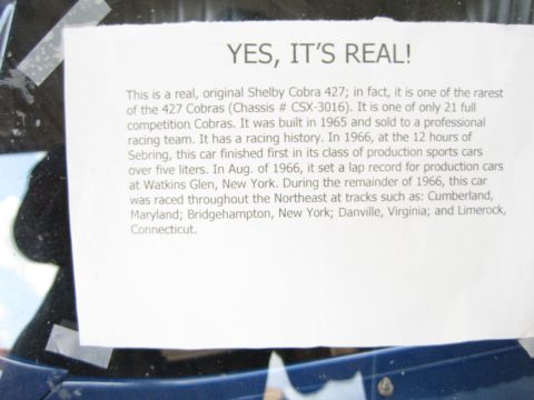 1968 Ford Mustang - Printed informational placard about a Shelby Cobra 427 taped to glass, not a technical document.