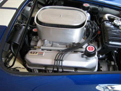 1968 Ford Mustang - The engine bay shows a prominent 427 Cobra engine with a large air filter assembly.