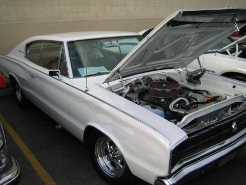 1968 Ford Mustang - This white Dodge Charger has a custom engine and flame decals on its side.