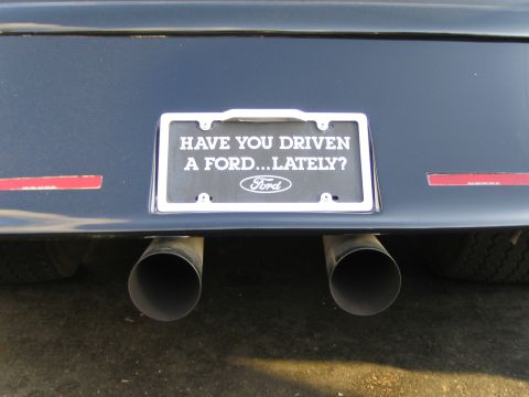1968 Ford Mustang - This vehicle features a custom license plate frame asking "HAVE YOU DRIVEN A FORD...LATELY?" and dual exhaust pipes.