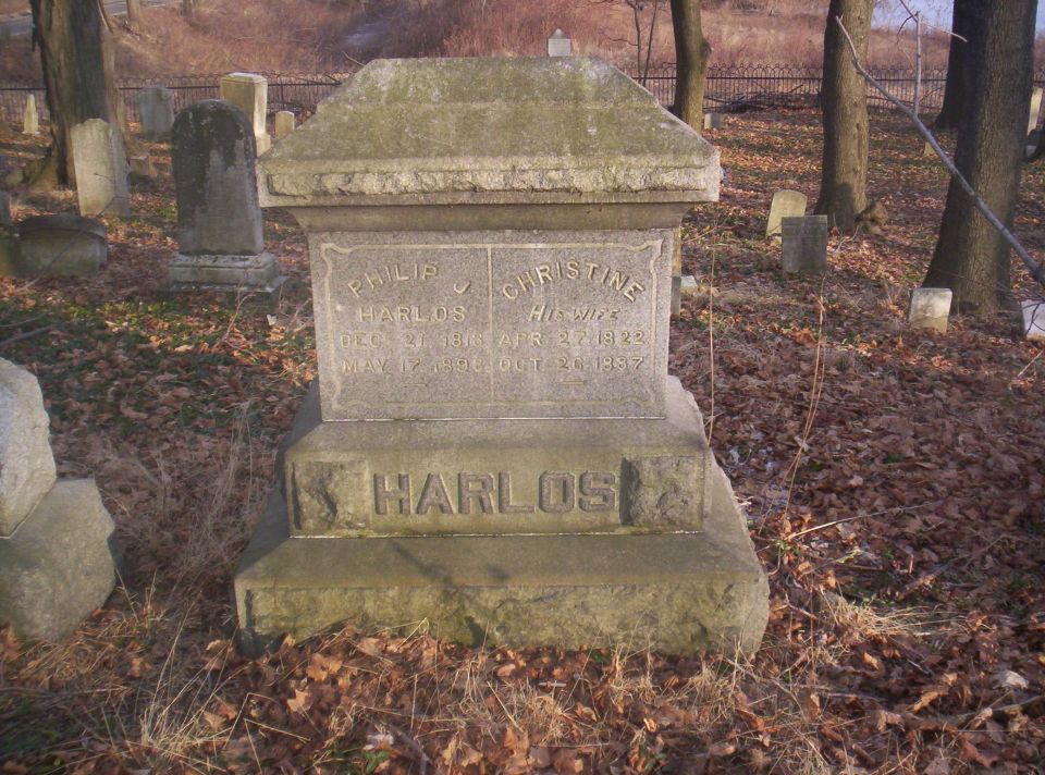Tombstone with names Philip and Christine Harlos and dates