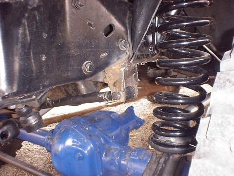 1988 Ford Bronco - Vehicle suspension components, including a differential and coil spring, are visible in this close-up shot.