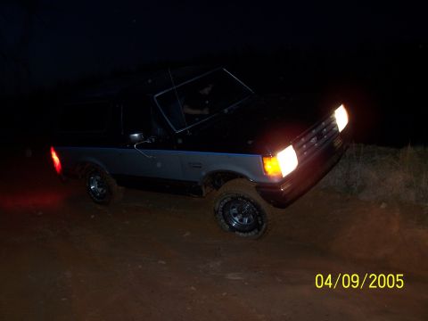 1979 Ford F-150 - This 1979 Ford F-150 is captured in action on a dirt path at night, its off-road capabilities.