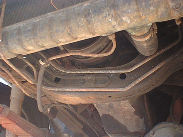 This is the front crossmember on a 77 1/2-79 F250. These had a revised frame from the earlier 77 and older F250's. The crossmember is very deep and the engine sits just behind it. The balancer is just barely above it and because of the way it cradles the engine the stock alternator mounting location can not be used.