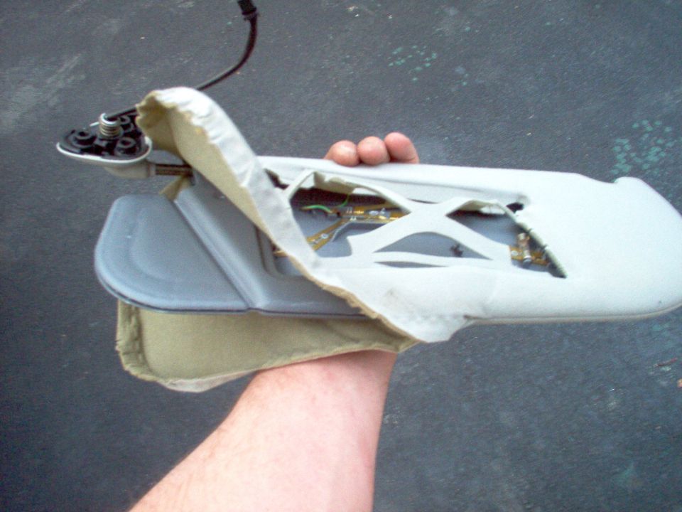 This visor came from an '02 LTC, but it won't fit my '94 CV, so I'm pulling the HomeLink out of it to mount somewhere in my car.
