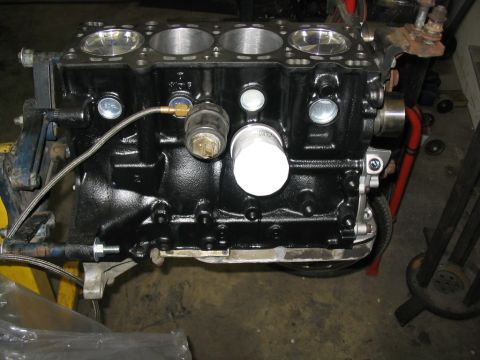 1993 Ford Probe - Close-up view of a black engine block, showing its internal cylinders and attached components.